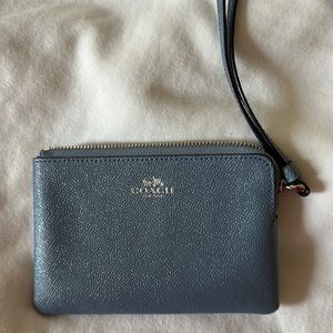 Like new Coach wristlet! Used once small light blue sparkle wristlet.